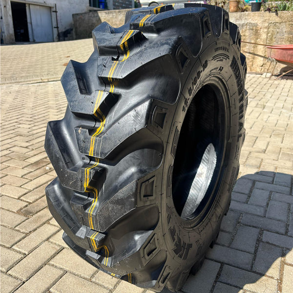 PNEU 12.5/80-18 OTR 12PR TL DX JK - Pneutek Pneus
