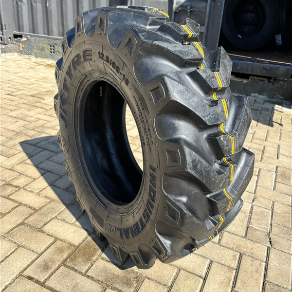 PNEU 12.5/80-18 OTR 12PR TL DX JK - Pneutek Pneus