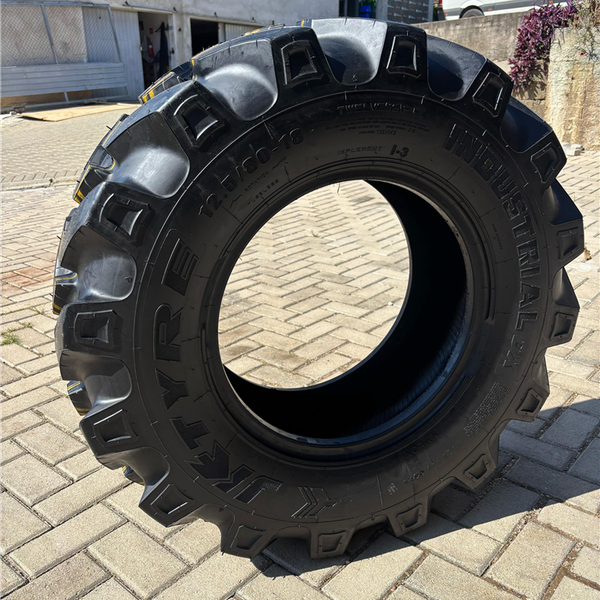 PNEU 12.5/80-18 OTR 12PR TL DX JK - Pneutek Pneus